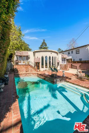 a view of a swimming pool with a patio