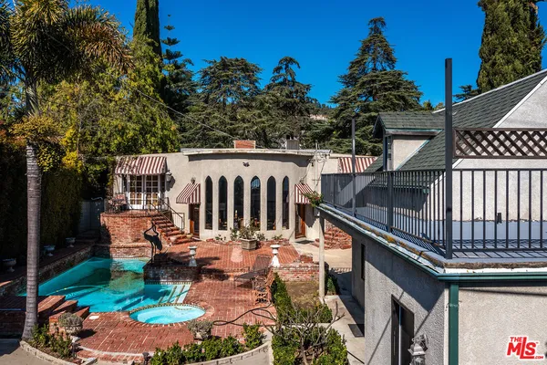 a view of a patio with swimming pool