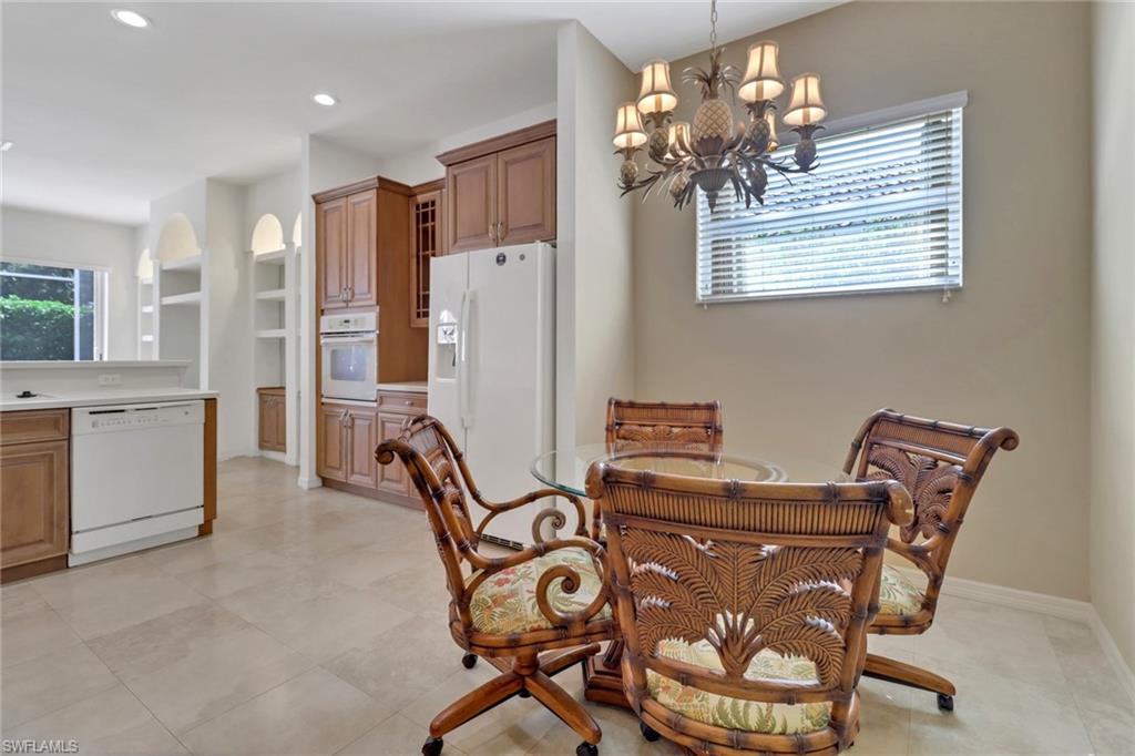 9246 Springview Loop Estero, FL 33928 - Photo 11 of 44 a view of a dining room with furniture and a chandelier