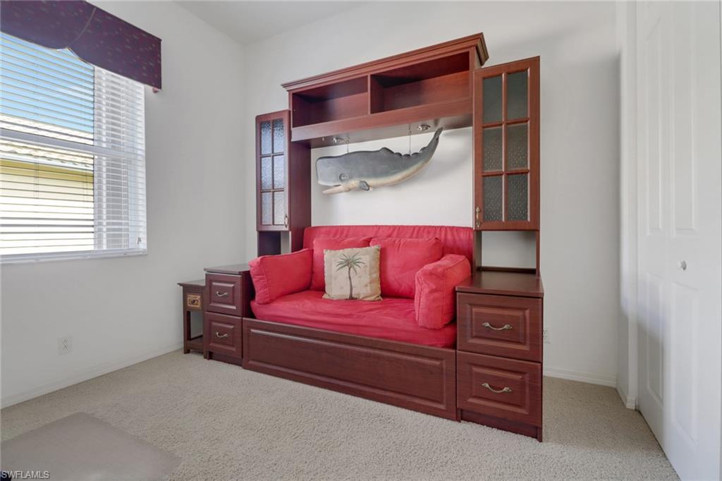 9246 Springview Loop Estero, FL 33928 - Photo 16 of 44 a bedroom with a bed and a dresser