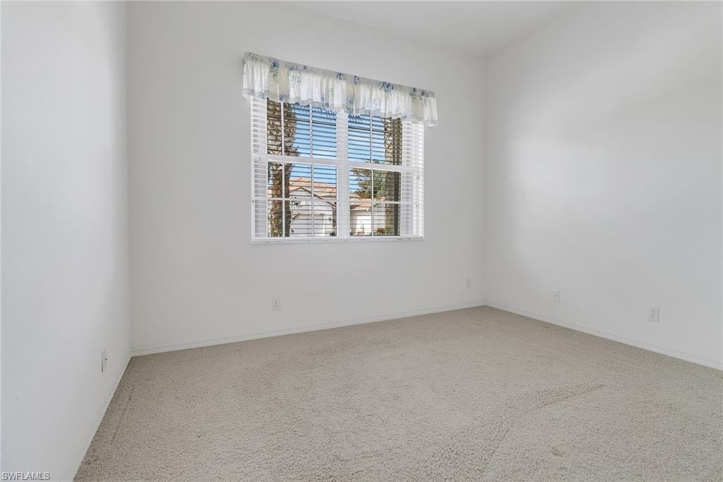 9246 Springview Loop Estero, FL 33928 - Photo 18 of 44 an empty room with a window