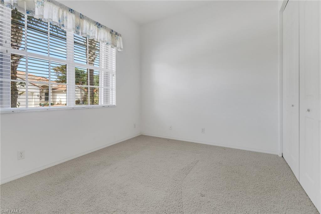 9246 Springview Loop Estero, FL 33928 - Photo 19 of 44 an empty room with a window