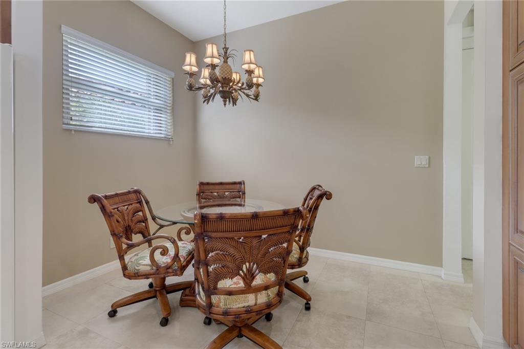 9246 Springview Loop Estero, FL 33928 - Photo 10 of 44 a view of a dining room with furniture and chandelier
