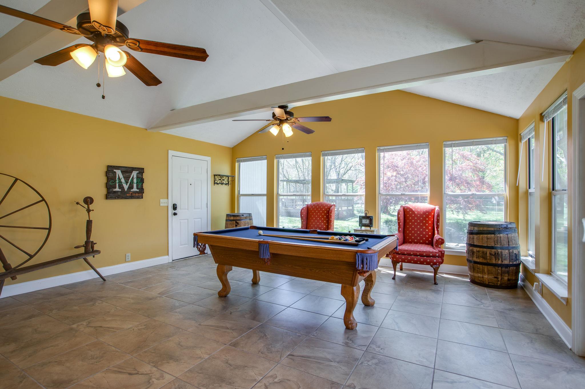 206 Bethlehem Road Lebanon, TN 37087 - Photo 13 of 27 This grand rec room located just off the kitchen area has floor to ceiling windows flanking the two back walls