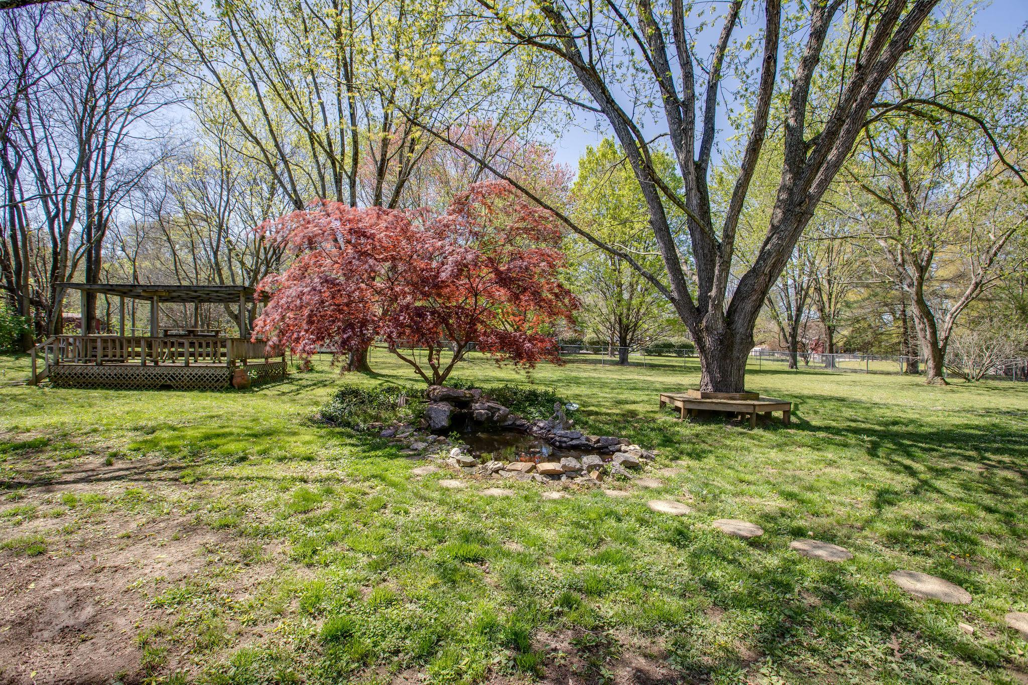 206 Bethlehem Road Lebanon, TN 37087 - Photo 21 of 27 The flowering trees, gazebo and koi pond create the feeling of a tranquil oasis