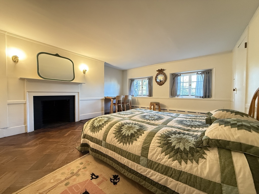 51 Pinckney Street Boston, MA 02114 - Photo 12 of 16 a bed sitting in a bedroom and chandelier