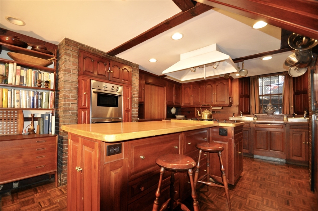 51 Pinckney Street Boston, MA 02114 - Photo 8 of 16 a kitchen with a sink a counter top space and stainless steel appliances