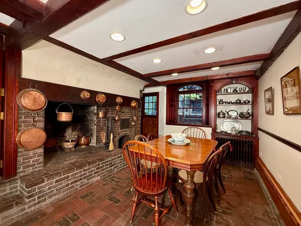 a dining room with furniture and window