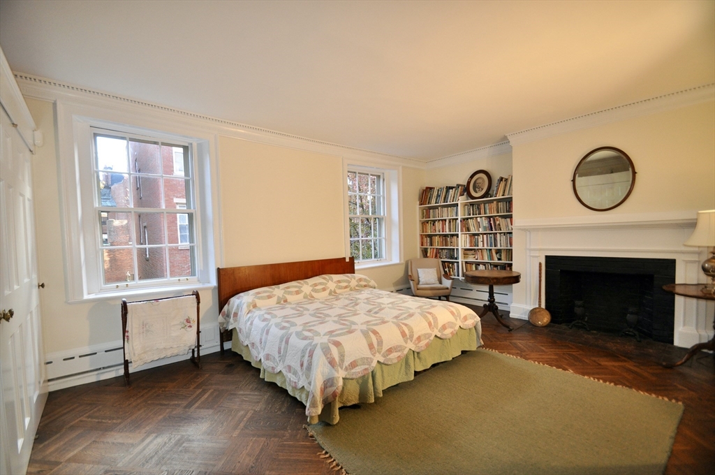 51 Pinckney Street Boston, MA 02114 - Photo 10 of 16 a bedroom with a bed and a window