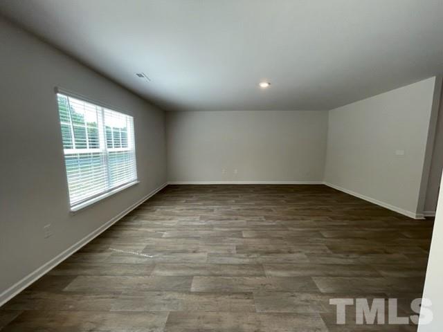 4027 Water Wheel Road Rocky Mount, NC 27803 - Photo 5 of 5 wooden floor in an empty room with a window