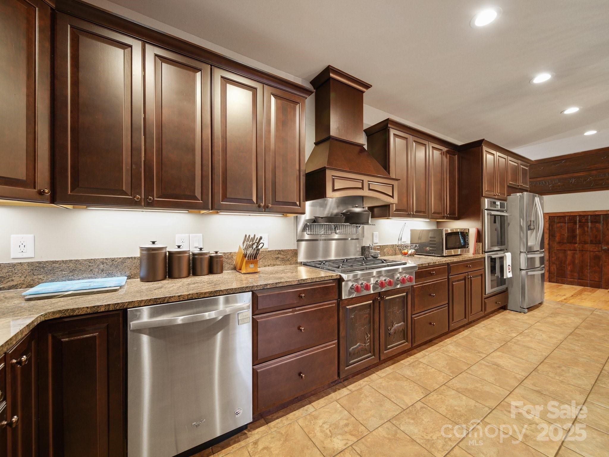 6153 Barclay Lane Clover, SC 29710 - Photo 5 of 27 a kitchen with stainless steel appliances granite countertop a sink stove and cabinets