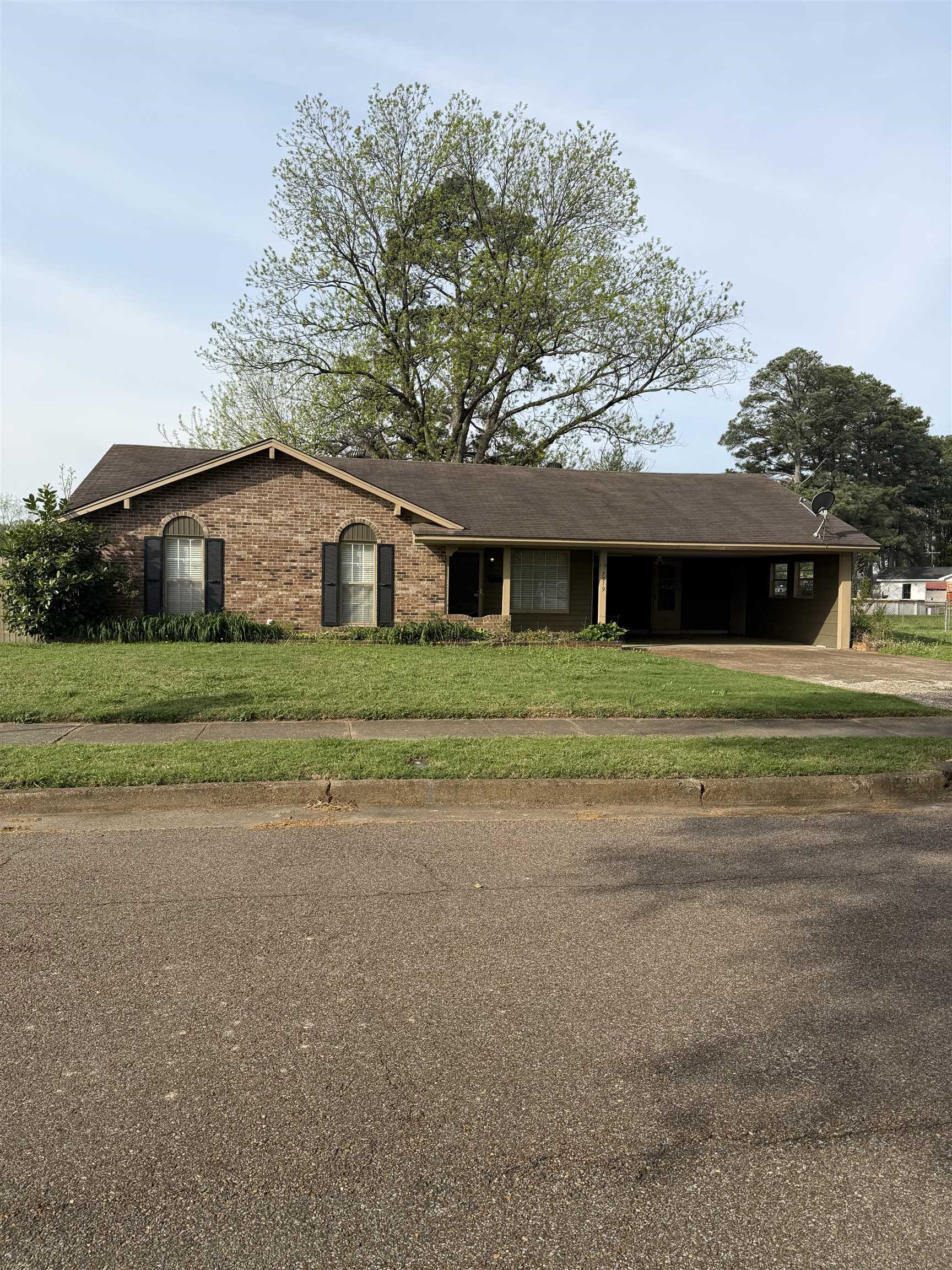 7919 Max Drive Millington, TN 38053 - Photo 1 of 13 a front view of a house with a big yard