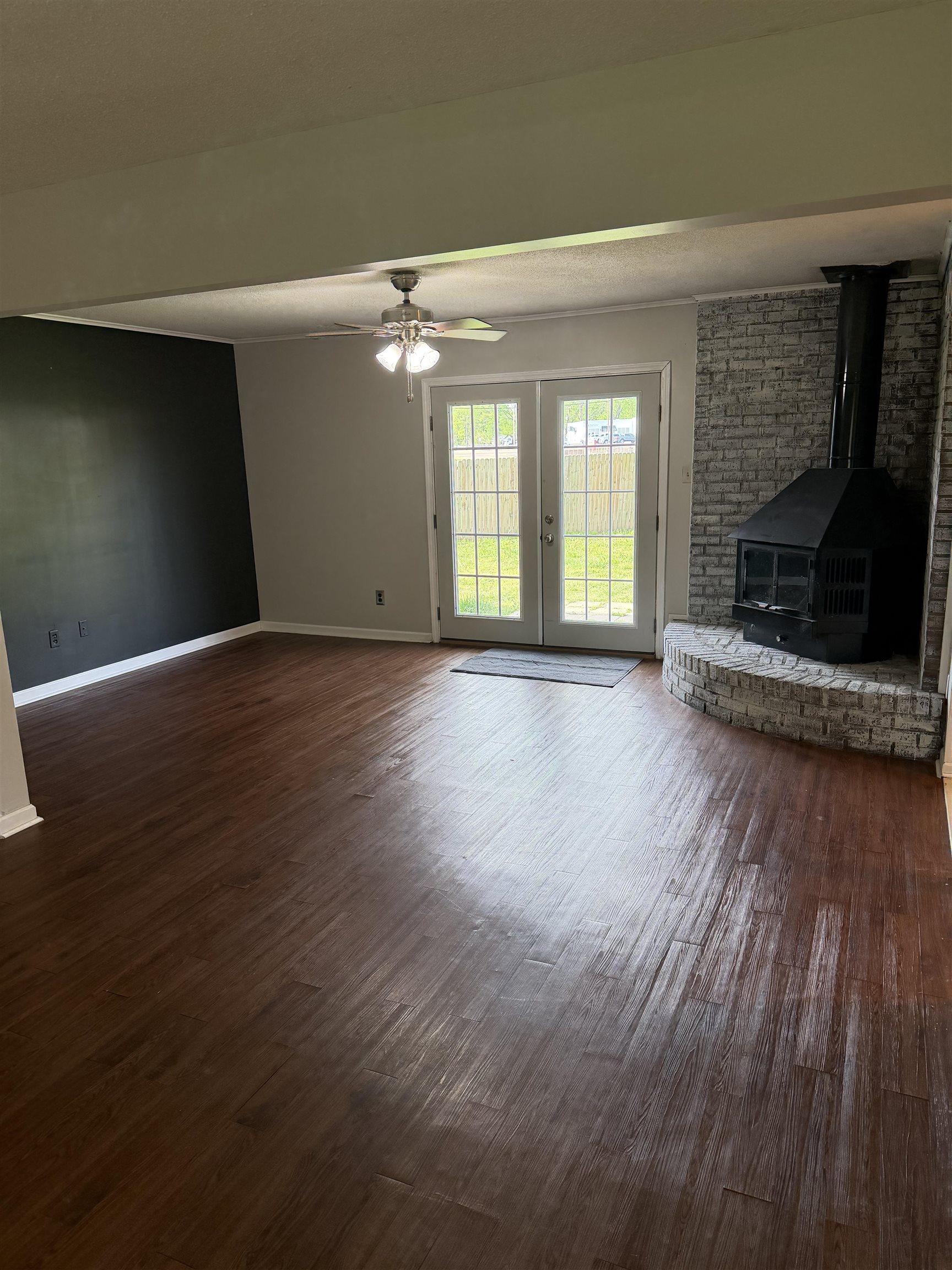 7919 Max Drive Millington, TN 38053 - Photo 12 of 13 a view of a livingroom with wooden floor and a fireplace