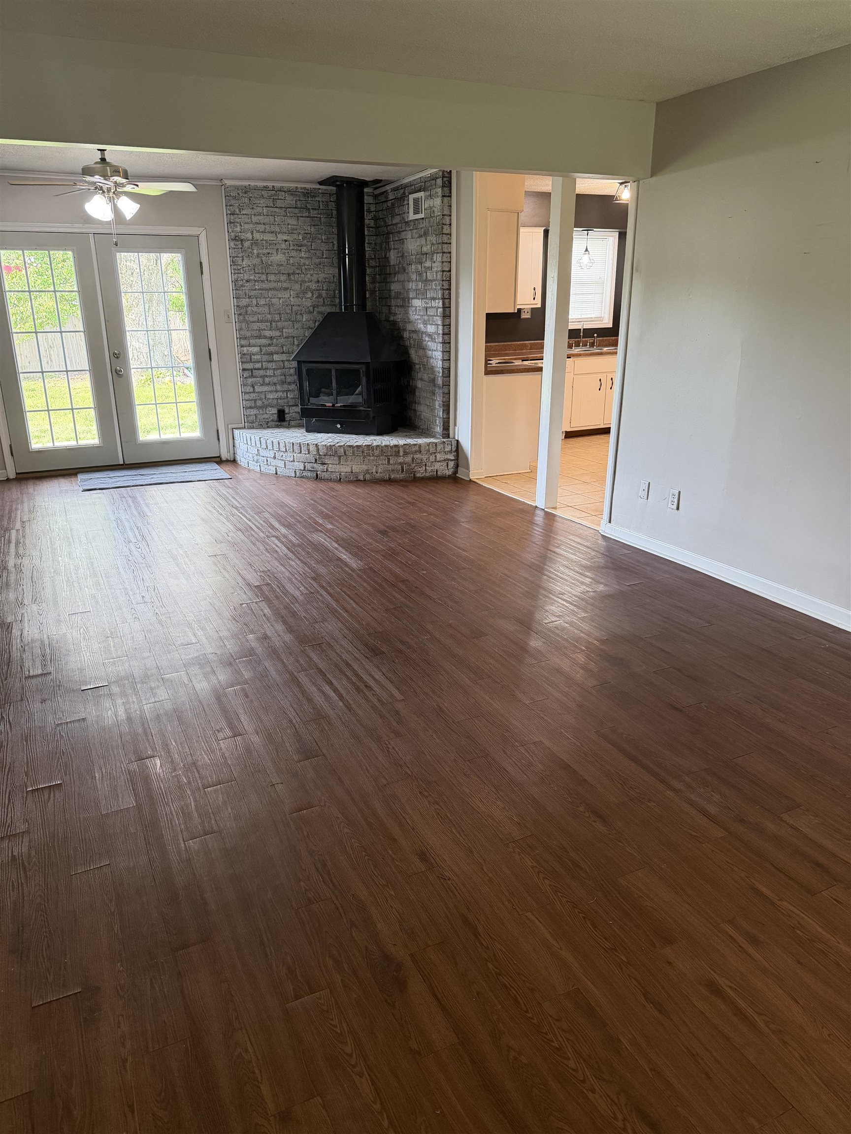 7919 Max Drive Millington, TN 38053 - Photo 13 of 13 an empty room with wooden floor and windows