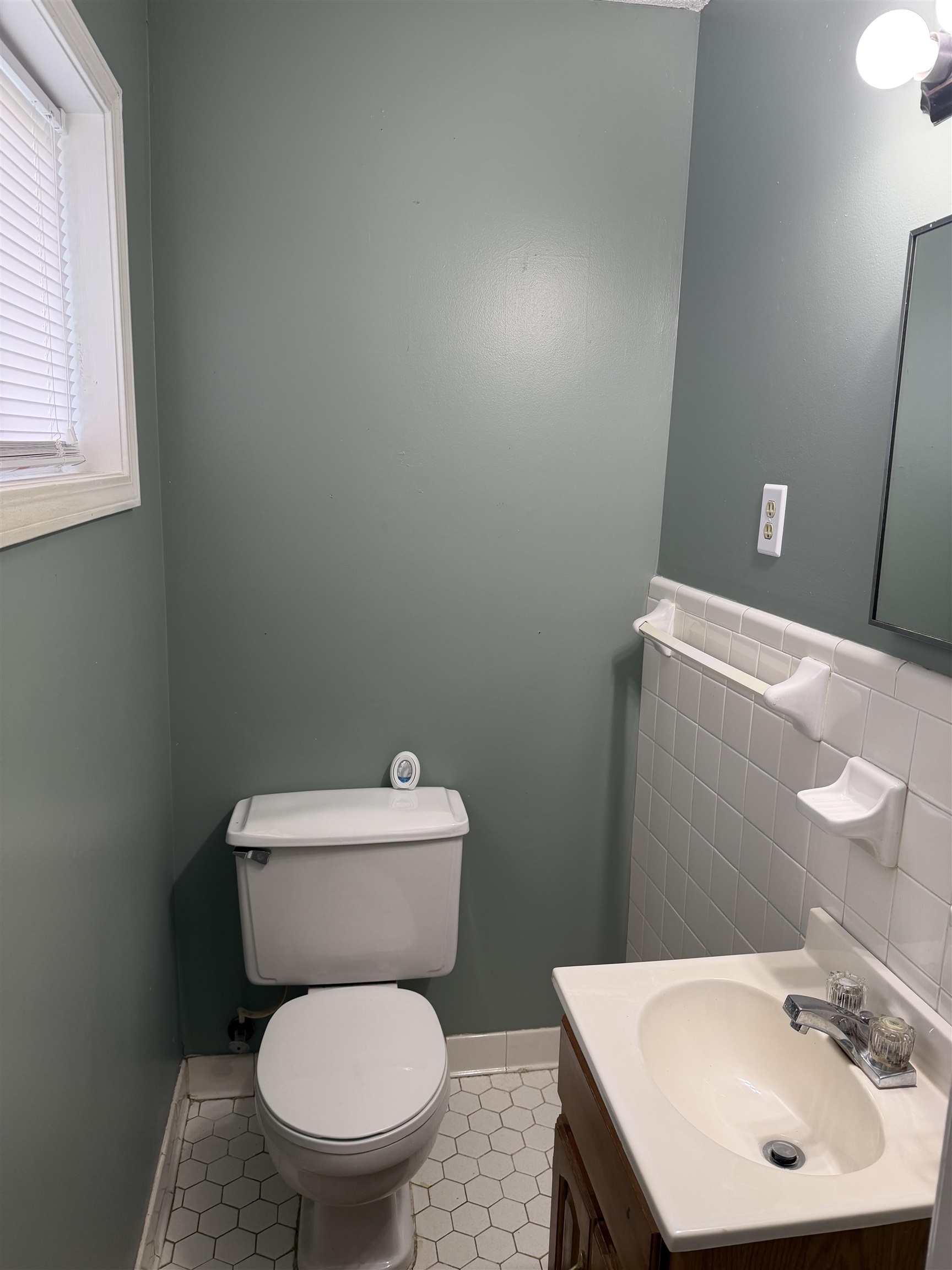 7919 Max Drive Millington, TN 38053 - Photo 3 of 13 a white toilet sitting next to a bathroom sink