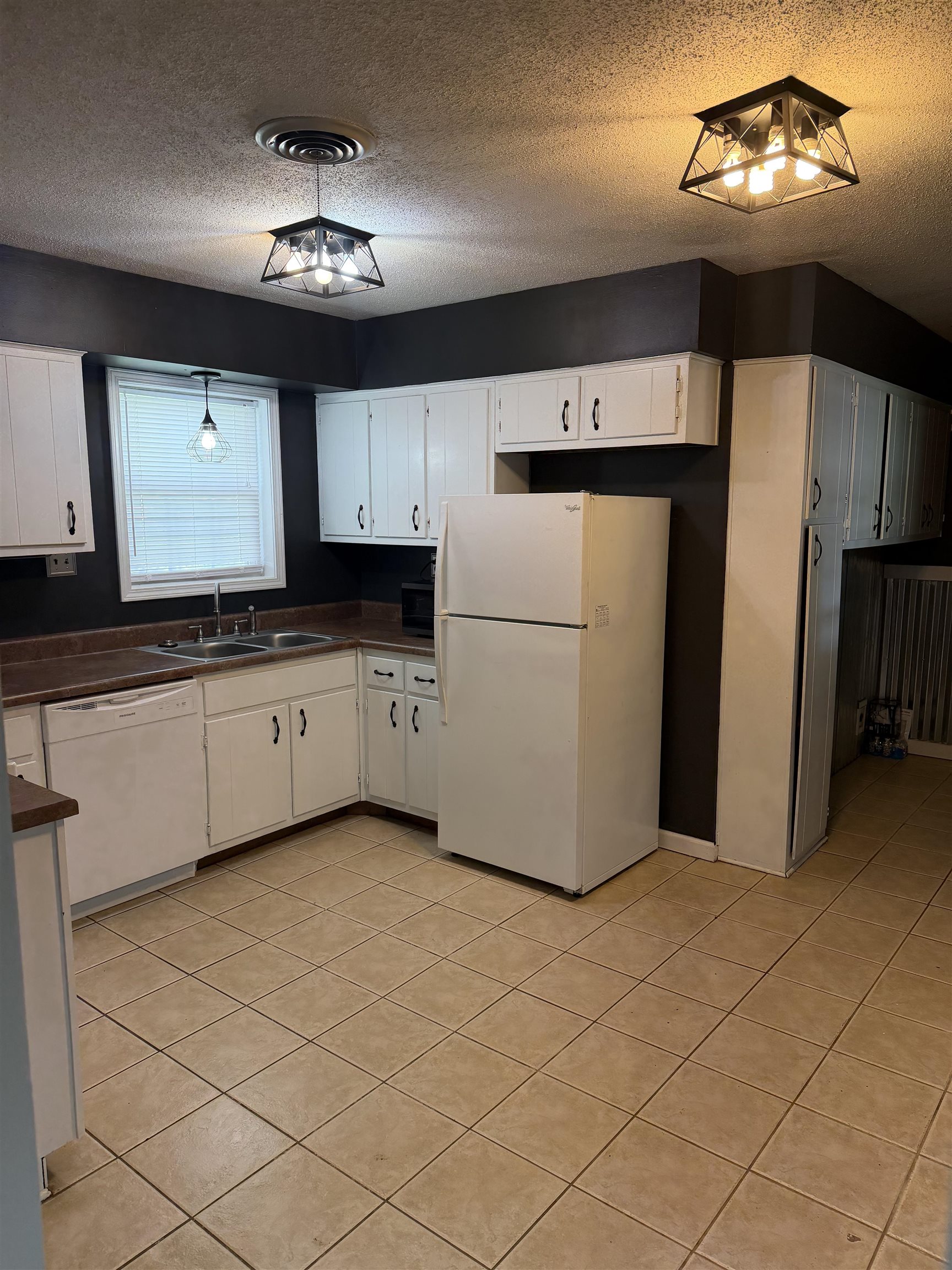 7919 Max Drive Millington, TN 38053 - Photo 6 of 13 a kitchen with stainless steel appliances a refrigerator sink and microwave