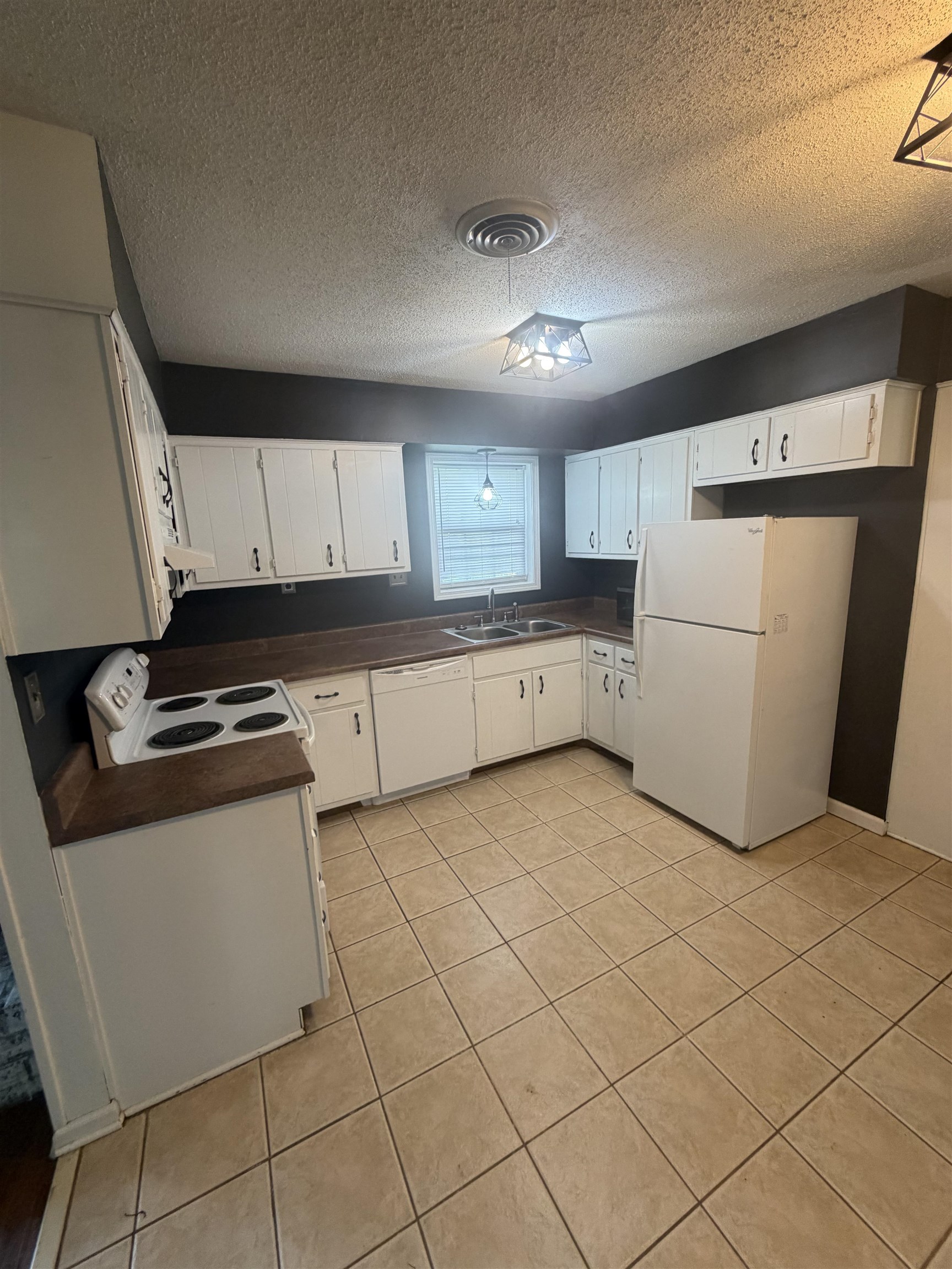 7919 Max Drive Millington, TN 38053 - Photo 9 of 13 a kitchen with a cabinets and a stove top oven
