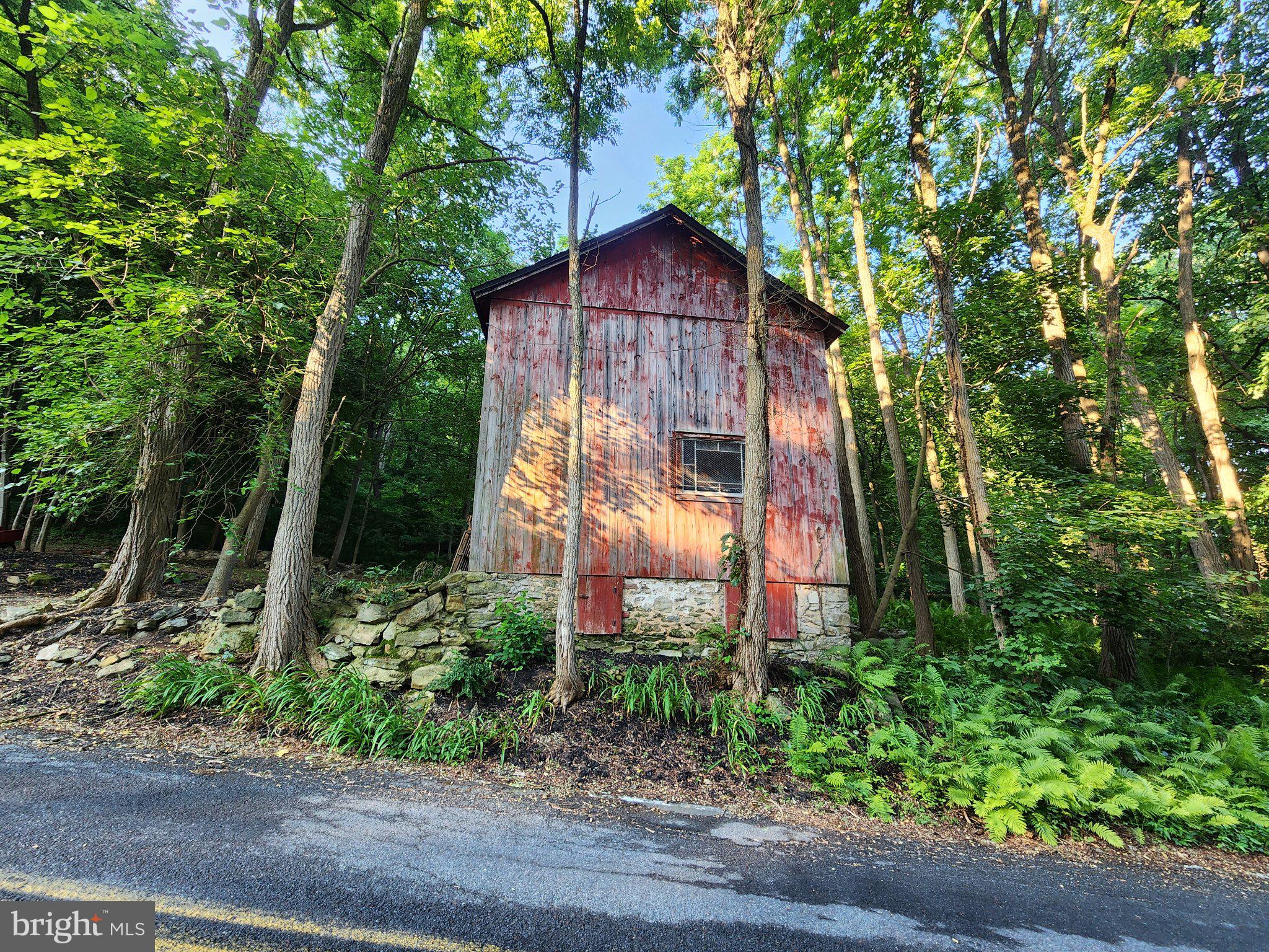 44 Wetzel Road Macungie, PA 18062 - Photo 4 of 5 Rustic charm amid lush greenery.