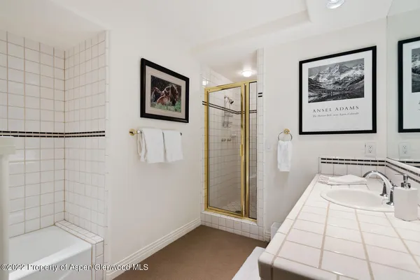 a bathroom with a bathtub and shower