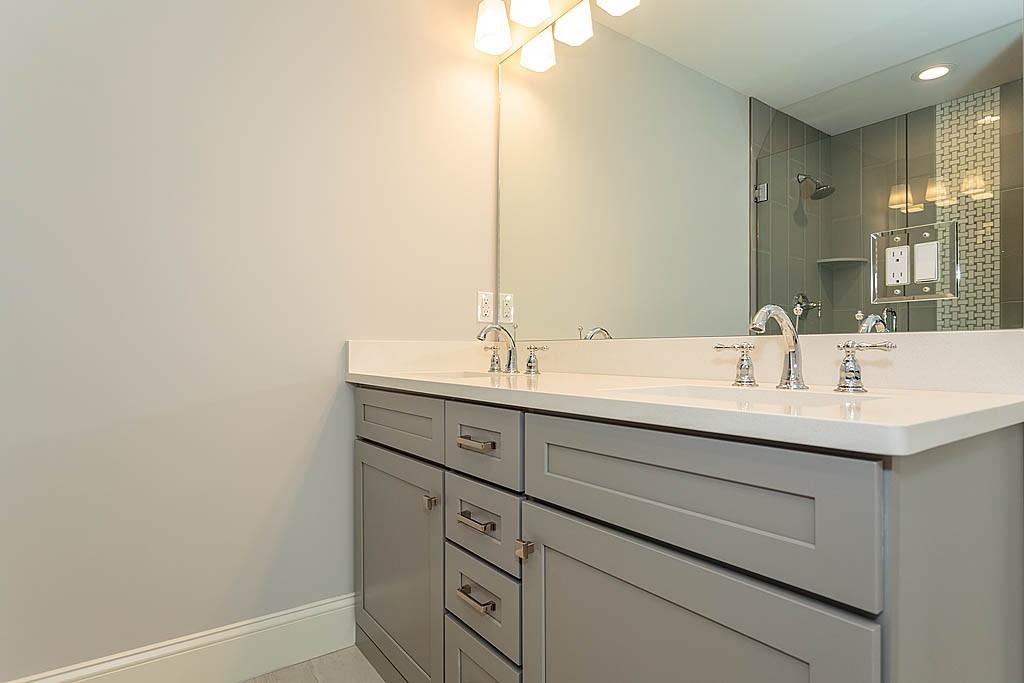 8 Cleveland Road, Unit A Winchester, MA 01890 - Photo 16 of 26 a bathroom with a sink and a mirror