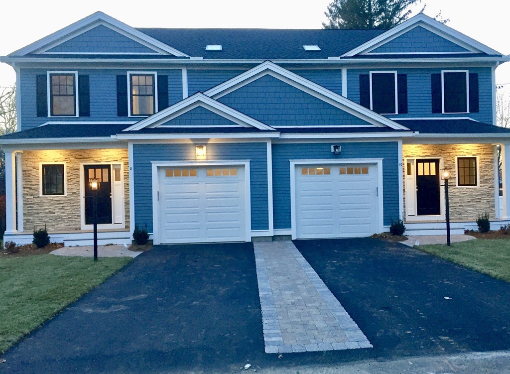 8 Cleveland Road, Unit A Winchester, MA 01890 - Photo 3 of 26 a front view of a house with a yard