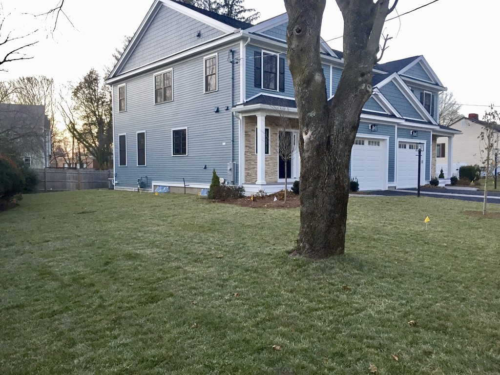 8 Cleveland Road, Unit A Winchester, MA 01890 - Photo 4 of 26 a view of a house with a yard