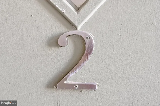 a view of staircase with a white wall