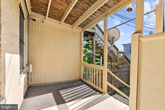 a view of a balcony with door