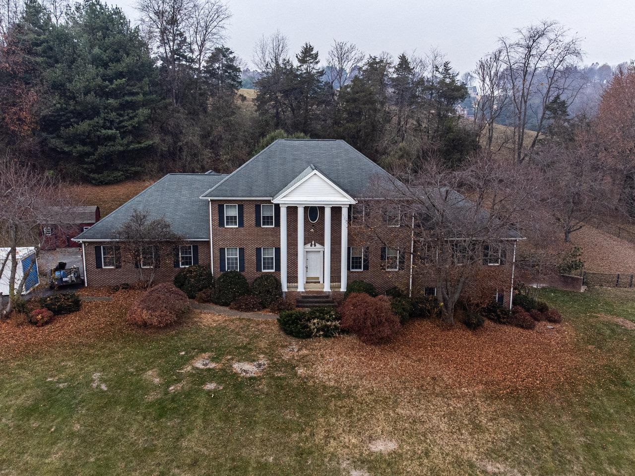 7664 Kiser Road Mount Crawford, VA 22841 - Photo 1 of 45 a front view of a house with garden