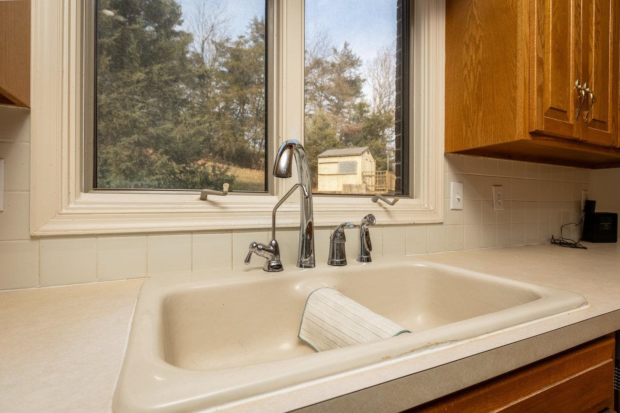 7664 Kiser Road Mount Crawford, VA 22841 - Photo 11 of 45 a bathroom with a sink and a mirror
