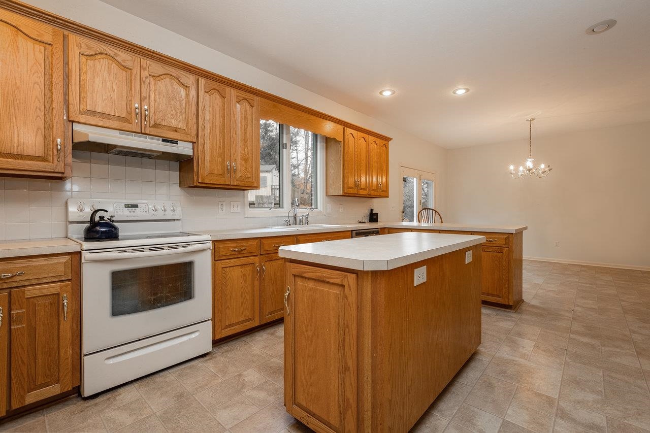 7664 Kiser Road Mount Crawford, VA 22841 - Photo 13 of 45 a kitchen with stainless steel appliances granite countertop a sink stove and cabinets