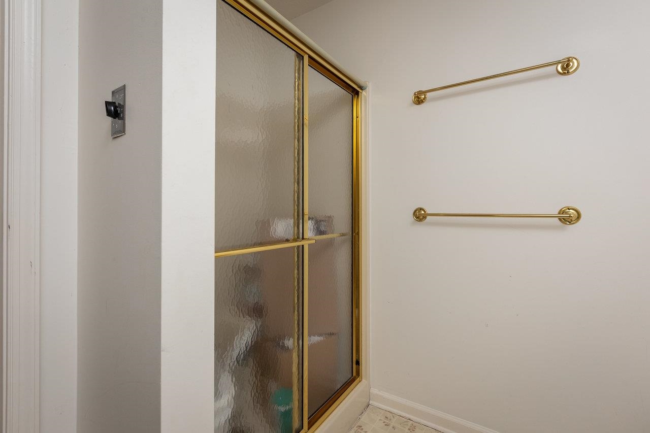 7664 Kiser Road Mount Crawford, VA 22841 - Photo 24 of 45 a bathroom with a glass shower door