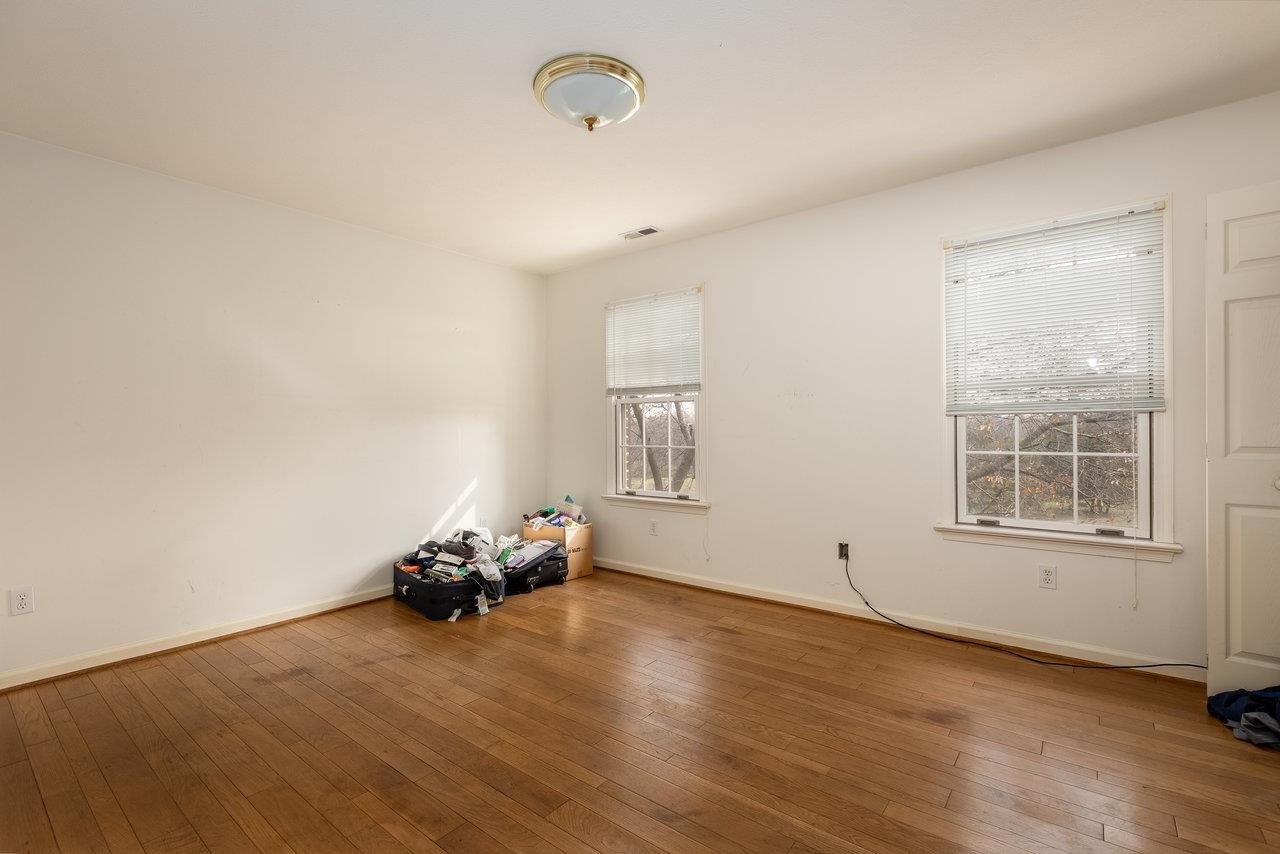 7664 Kiser Road Mount Crawford, VA 22841 - Photo 29 of 45 an empty room with wooden floor and windows