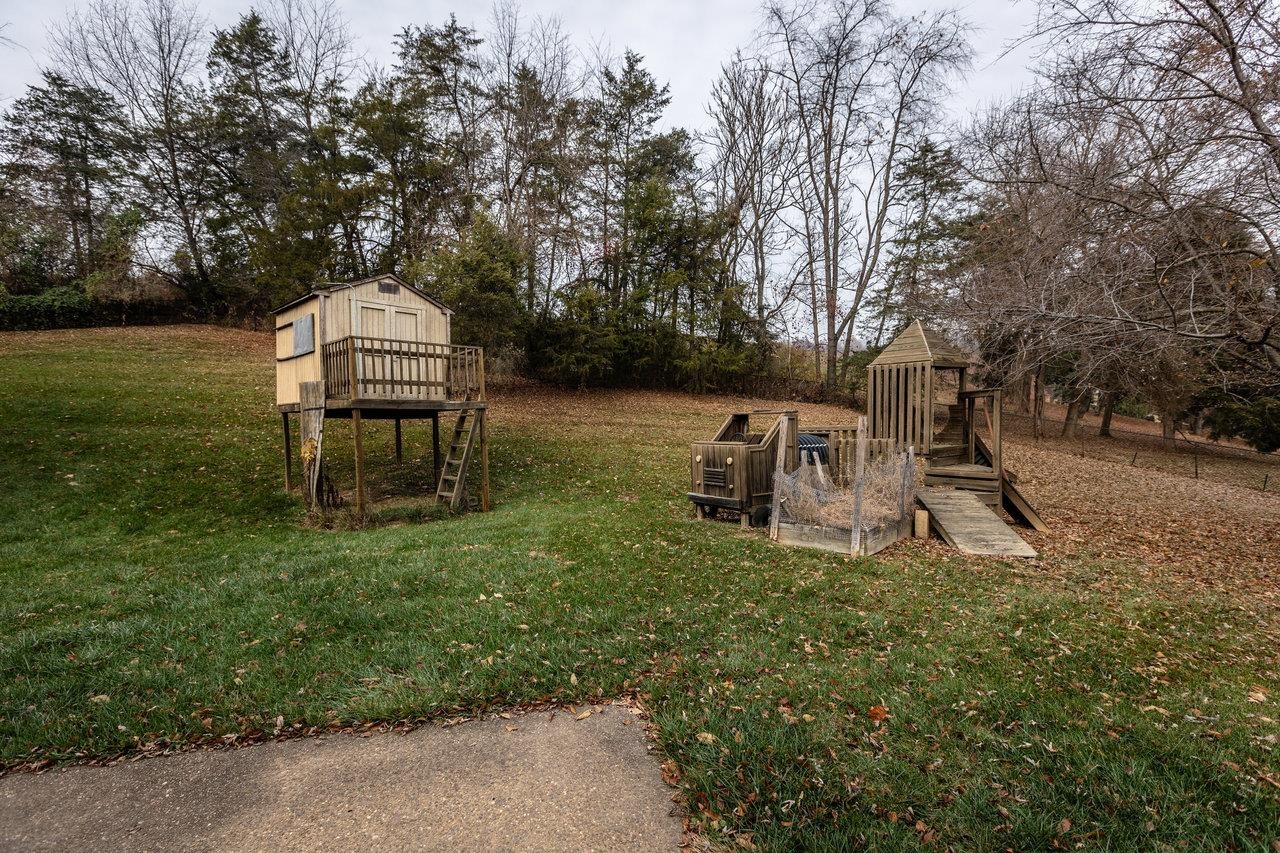 7664 Kiser Road Mount Crawford, VA 22841 - Photo 35 of 45 a view of a fire pit with a bench in a garden