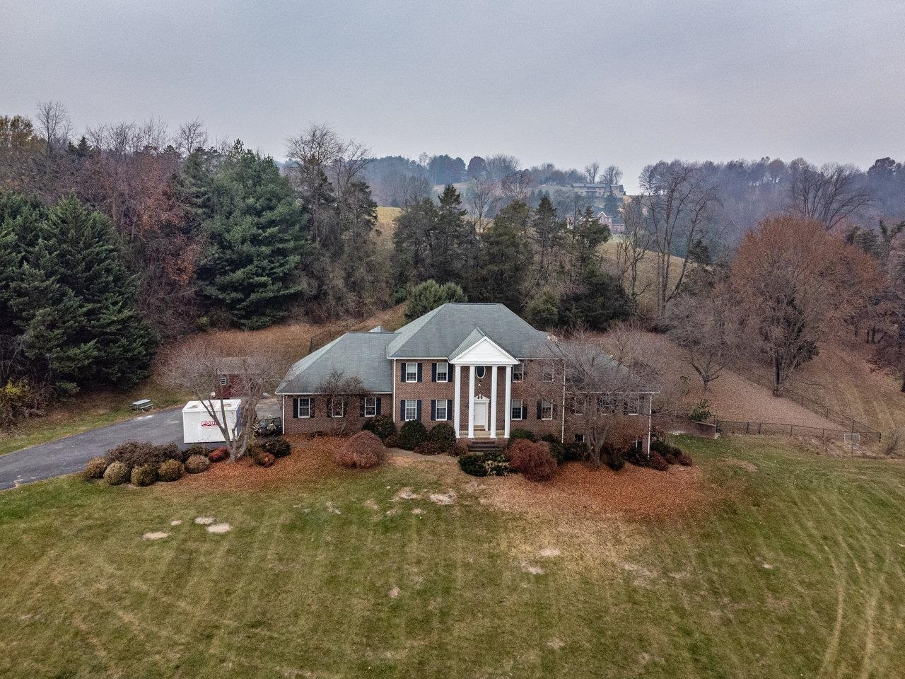 7664 Kiser Road Mount Crawford, VA 22841 - Photo 40 of 45 a front view of a house with a yard and mountain view in back