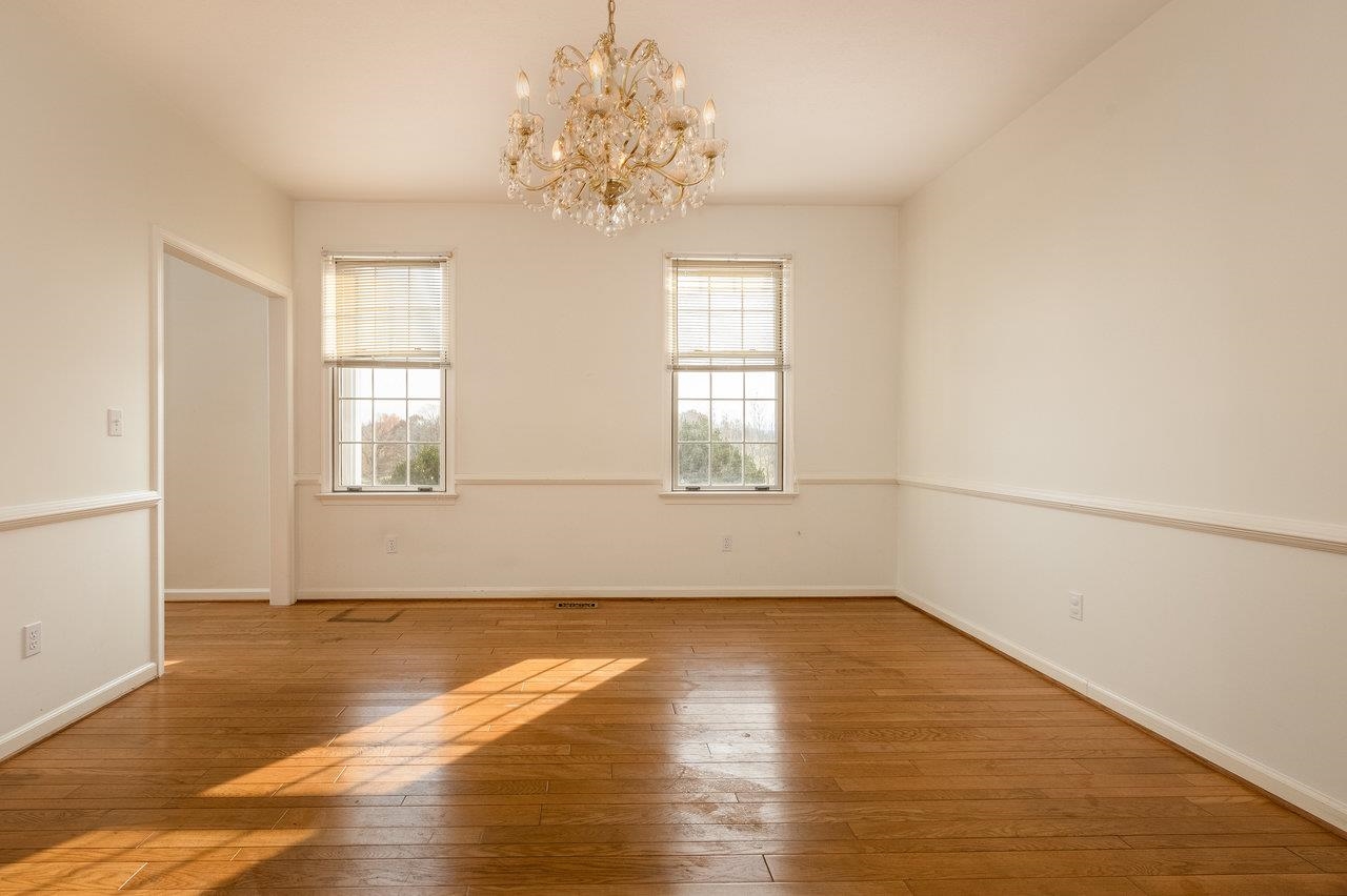 7664 Kiser Road Mount Crawford, VA 22841 - Photo 6 of 45 an empty room with wooden floor and windows