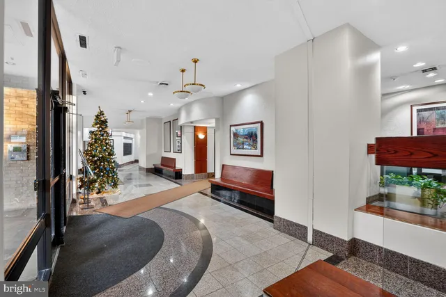 a view of a livingroom with furniture and a flat screen tv