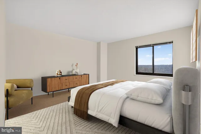 a bedroom with a bed and window