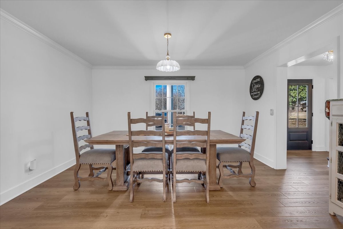 251 Miller Road Hillsboro, TN 37342 - Photo 22 of 80 a view of a dining room with furniture wooden floor and a clock