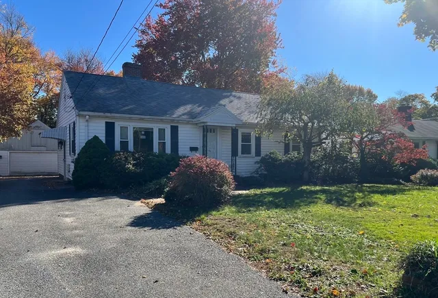 a view of a house with a yard and plants