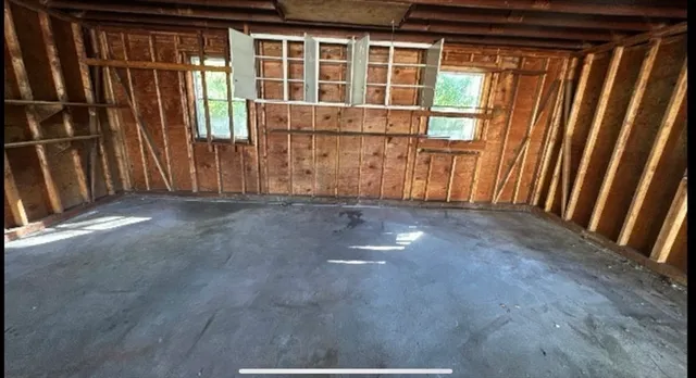 an empty room with windows