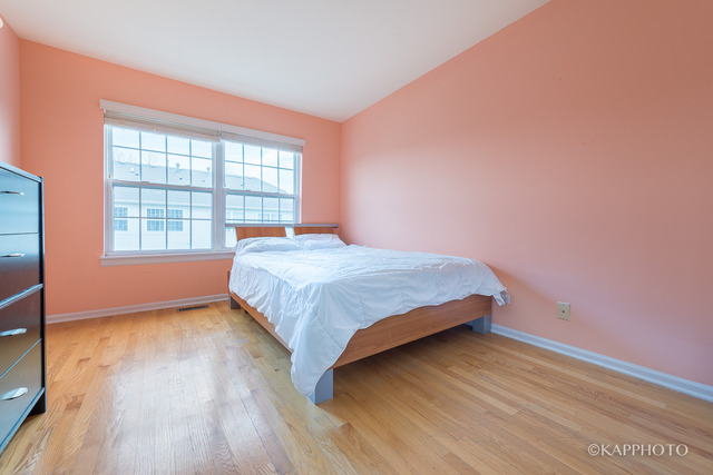 1270 Georgetown Way Vernon Hills, IL 60061 - Photo 14 of 25 a bedroom with a bed and a window