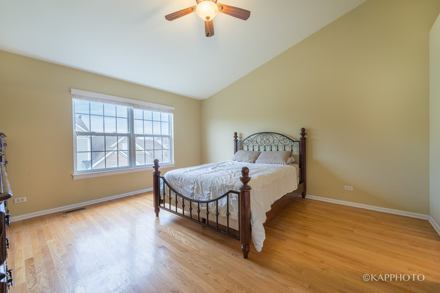 1270 Georgetown Way Vernon Hills, IL 60061 - Photo 16 of 25 a bedroom with a bed and window
