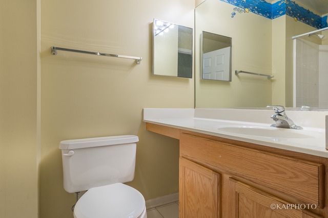 1270 Georgetown Way Vernon Hills, IL 60061 - Photo 21 of 25 a bathroom with a sink and a toilet