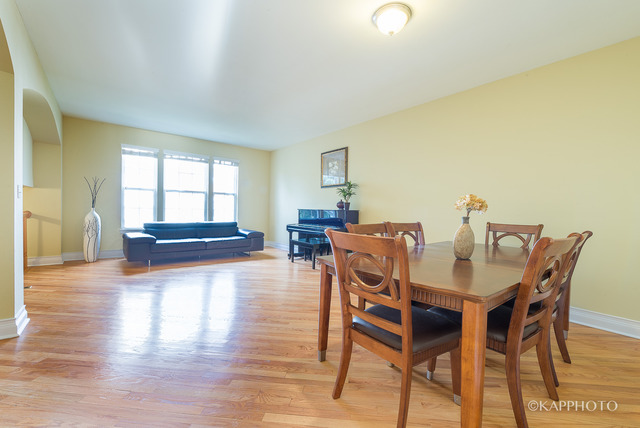 1270 Georgetown Way Vernon Hills, IL 60061 - Photo 4 of 25 a dining room with furniture and wooden floor