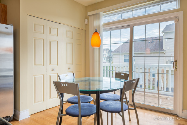 1270 Georgetown Way Vernon Hills, IL 60061 - Photo 7 of 25 a view of a dining room with furniture wooden floor and next to a window