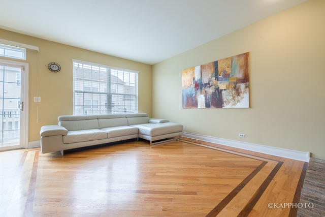 1270 Georgetown Way Vernon Hills, IL 60061 - Photo 9 of 25 a living room with furniture and a large window
