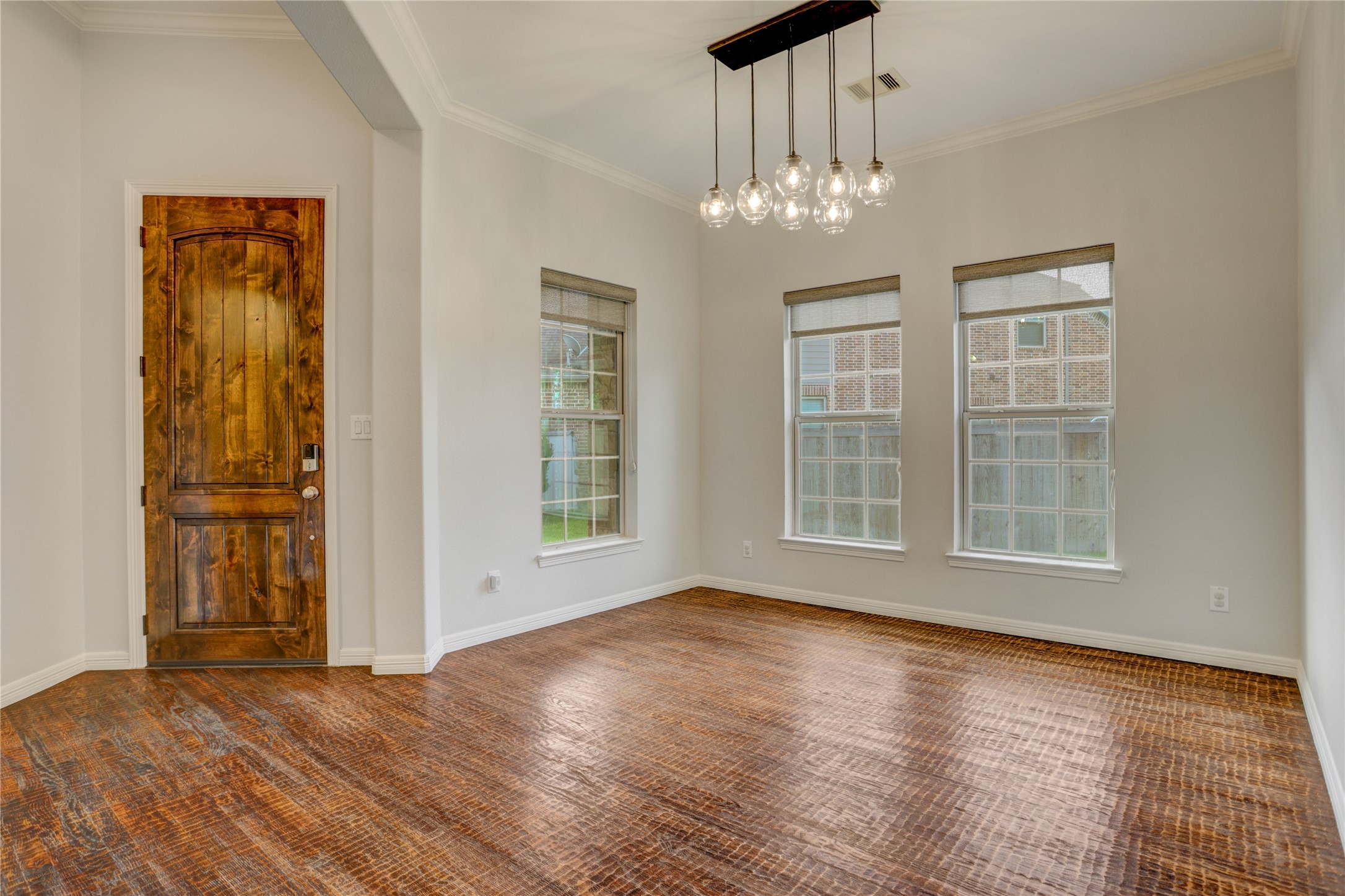 3002 Currant Drive Manvel, TX 77578 - Photo 6 of 43 a view of an empty room with wooden floor and a window