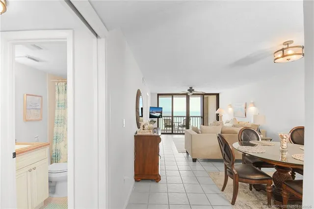 a living room with furniture a window and flowerpot