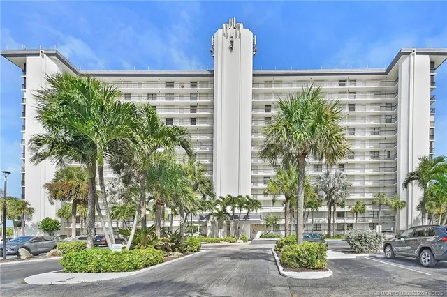 a front view of a building with garden